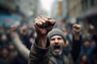 © Firn - Raised fists in crowd of rioting angry people