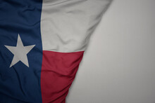 Big Waving National Colorful Flag Of Texas State On The Gray Background.