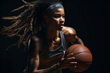 Fototapeta Sypialnia - Young female athlete with afro hair style playing basketball on black background.
