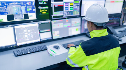 Engineer working at control room,Manager control system,Technician man monitoring program from a lot of monitor
