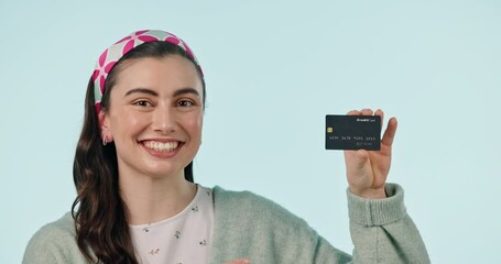 Sticker - Face, smile and credit card to bank with a woman in studio on blue background for finance or accounting. Portrait, ecommerce or retail with a happy young customer looking to invest in economy growth