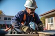 © Martin - construction worker working outside wearing hard hat and high-vis jacket