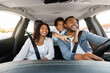 © Prostock-studio - Beautiful african american family enjoying car trip together