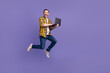 © deagreez - Photo of funky cheerful guy wear plaid clothes hand hold use macbook run empty space buy modern device isolated on purple color background