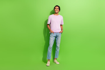 Sticker - Full length photo of cool dreamy man dressed purple t-shirt looking empty space isolated green color background