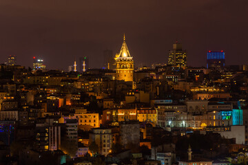 Wall Mural - Night cityscape of Istanbul with the Galata Tower illuminated,  Turkey