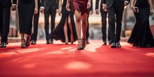 Group Of People Dressed In A Tuxedo And Beautiful Dresses Are Standing On The Red Carpet. Generative AI
