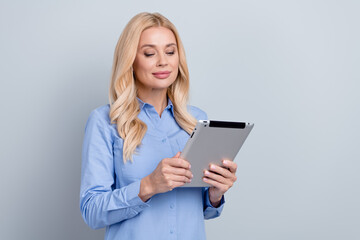 Sticker - Portrait of pretty successful elegant lawyer use tablet communicate empty space ad isolated on grey color background