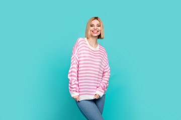 Sticker - Photo of pretty shiny girl dressed striped sweater smiling walking isolated teal color background