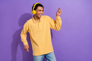 Wall Mural - Photo of good mood person with cornrows wear stylish shirt dancing in headphones enjoy playlist isolated on purple color background