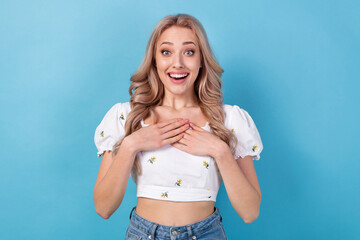 Wall Mural - Photo of funny impressed lady wear white blouse arms chest smiling open mouth isolated blue color background