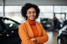 Smiling Portrait Of A Female African American Car Salesman Working In A Car Dealership