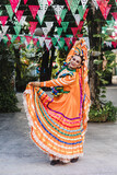 Mexican woman dancing and wearing traditional dress from Guadalajara Jalisco Mexico, hispanic female in independence day or parade or cultural Festival 
