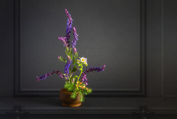 Wall Mural - Floral arrangement in a minimalist style on a dark background.