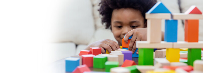 little boy hands of little children play blocks in classroom. learning by playing education group st