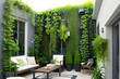 © indofootage - Wall plants on the backyard house with terrace, hanging green plants and garden. Outside view