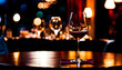 © anmitsu - Glasses placed on restaurant table with table coordination setup and sparkling bokeh background
