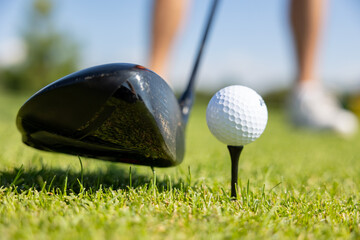 Golf sticks and golf balls for background with green grass