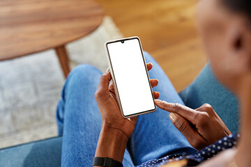 Close up of african woman using smartphone at home