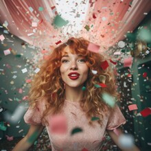 A Bold And Beautiful Woman Celebrates Her Individuality With A Fiery Red Hairdo And Vibrant Red Lipstick, Standing Triumphantly Under A Shower Of Confetti