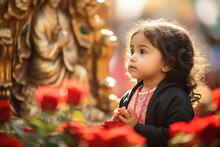 A Young Child Gazing In Wonder At A Beautifully Detailed Statue Of Our Lady Of Guadalupe On Her Feast Day, Surrounded By Roses