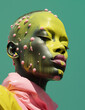 © ADDICTIVE STOCK - Eccentric african woman with yellow and pink fluid makeup in latex jacket with eyes closed against green background in studio. Generative AI