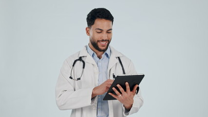 Poster - Doctor, man and tablet for healthcare service, social media and clinic software, internet scroll or research in studio. Happy medical worker on digital technology or hospital app on white background