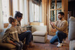 © Manu Reyes - Capturing Family Moments: Parents and 4-Year-Old Daughter Enjoy Mobile Photography in Cozy Rustic Home - Love, Laughter, and Family Bonding