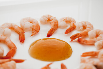 Wall Mural - Peeled shrimps in a bowl isolated on white background. Top view