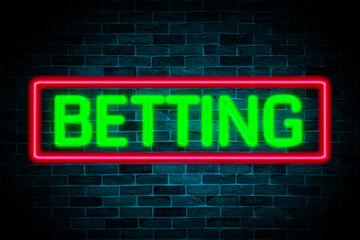 Sticker - Betting text neon banner on brick wall background.