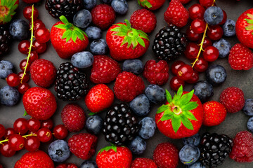 Wall Mural - Berries Background. Strawberries, Blueberry, Raspberries, and Blackberry.