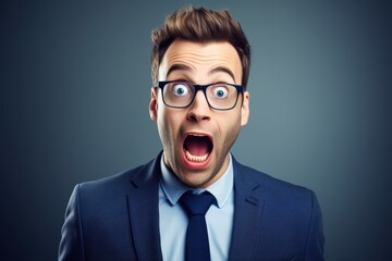 Wall Mural - A man wearing a suit and tie with a surprised expression on his face. This image can be used to depict shock, surprise, or unexpected situations.