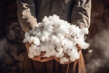 A Person Holding A Pile Of Cotton. This Image Can Be Used To Represent Textile Industry, Cotton Harvesting, Or Manufacturing Process.