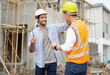 © offsuperphoto - worker or architect giving hi five pose celebrating success at work on the construction site