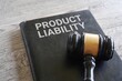 Closeup image of judge gavel and text PRODUCT LIABILITY on table.