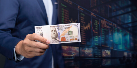 holding money dollar bills concept, wealth creation through smart investments in the stock market. Maximize your earnings and trade for profit with our expert guidance in finance and investment.