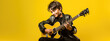 © MP Studio - Teenage boy playing guitar on yellow background