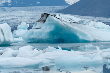 Wall Mural - Glacial ice floating in the Jokulsarlon Glacial Lagoon, Iceland. Showing natural patterns in the ice formations