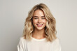 © deagreez - Generative AI portrait charming blonde hair girl woman smiling white teeth isolated pastel color wall background