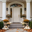 Main entrance to the luxury house with autumn decoration flower and autumn pumpkins decoration, beautiful and elegant white door with autumn deco and pumpkins, modern and elegant entrance, Autumn time