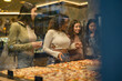 © PintoArt - group of women in an Italian restaurant choosing pizza - takeaway -