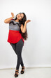 © Anupam - Studio shot of a young, beautiful Indian female model in casual wear wearing red and grey designer top and black jeans against white background. Female model. Fashion Portrait.
