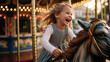 © SnowElf - Happy toddler kid joyfully ride a carousel horse. Classic round carousel with horses, magic childhood, amusement park.