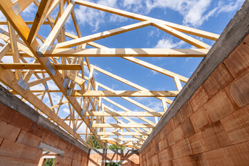 Wall Mural - Low angle view of support roof beams and ceilings in new building