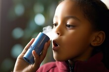 Closeup Of An Asthma Inhaler Held By A Child, Depicting The Increase In Respiratory Conditions Due To Poor Air Quality From Carbon Emissions.