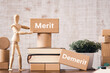 © hogehoge511 - There is wood block with the word Merit Demerit. It is as an eye-catching image.