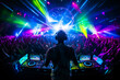 © MVProductions - Crowd of people at live DJ event. Venue or festival, with bright neon lasers above the crowd. Electronic music concept