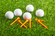 golf ball with orange tee in golf course 