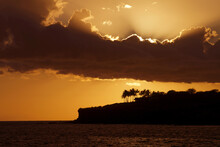 Hawaii, Lanai, Bright Orange Sunset And Silhouetted Palm Trees, View From Manele Bay.
