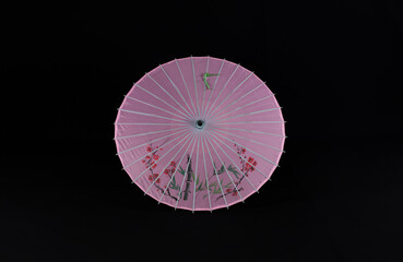 Sticker - chinese paper umbrella on black background